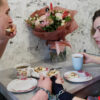 Alexandr Kudlay and Viktoria Pustovitova have breakfast in their apartment in Kharkiv